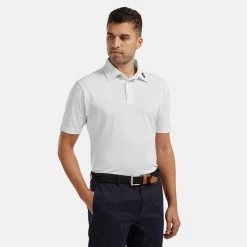 FootJoy Stretch Pique Solid Golf Polo Shirt -Golf Clothing Shop FOOTJOY 91823 FJ PERF SS SHIRT ATH WHITE Model 1