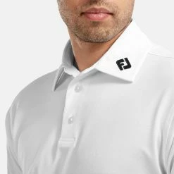 FootJoy Stretch Pique Solid Golf Polo Shirt -Golf Clothing Shop FOOTJOY 91823 FJ PERF SS SHIRT ATH WHITE Model 2