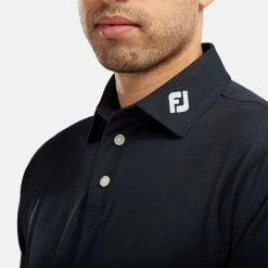 FootJoy Stretch Pique Solid Golf Polo Shirt -Golf Clothing Shop FOOTJOY PERF SS SHIRT ATH NAVY Model 2