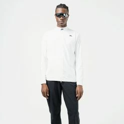 Jlindeberg J.Lindeberg KV Hybrid Golf Wind Jacket -Golf Clothing Shop J.Lindeberg AW22 KV Hybrid Jacket GMOW05623 0000 WTLIN039 White Model 1